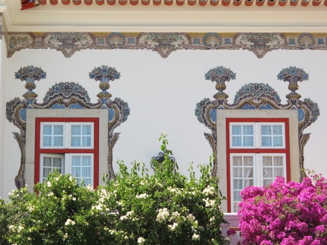 A close up view of the beautiful tiles on the front wall of the Pergola B & B.