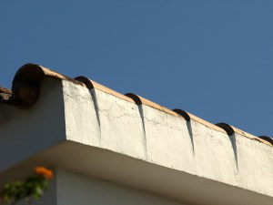 A very professional barge ending on a mission tile roof.  