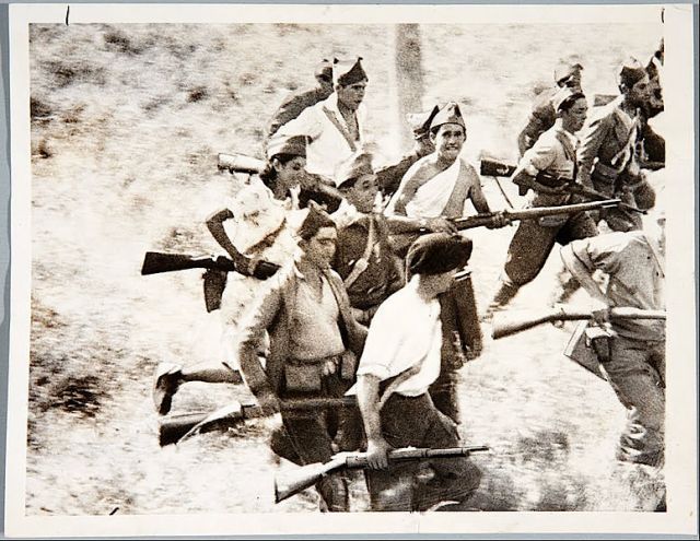 Young republicans plunging towards death attacking a Nationalists position near Madrid in 1936. Image credit: In the public domain via Wikipedia. 