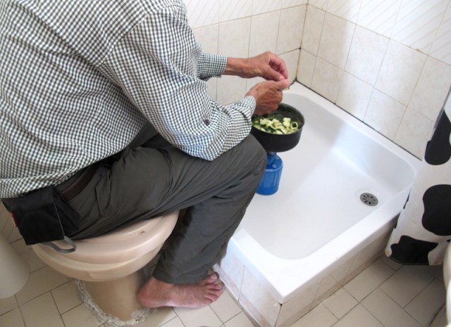 Preparing a meal in the shower recess.