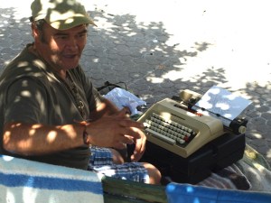 Our mystery man and his typewriter. 