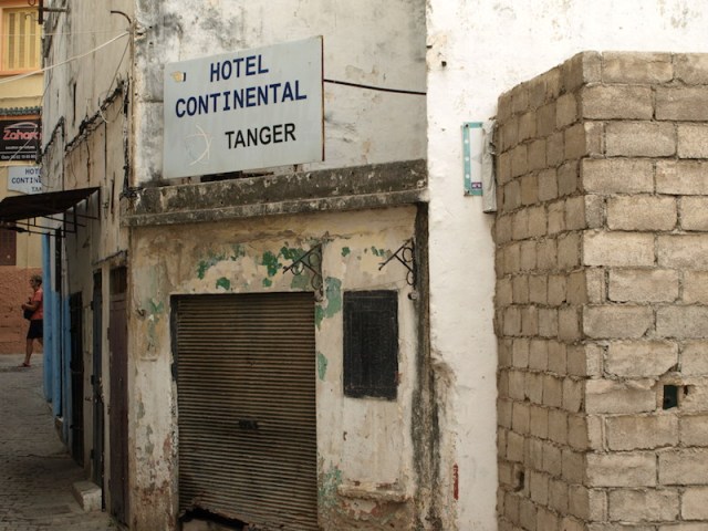 Sign along the alleyway leading to the Continental Hotel. 