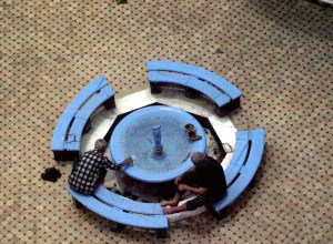 Two Muslim men going through the ablution process known as wudu prior to praying