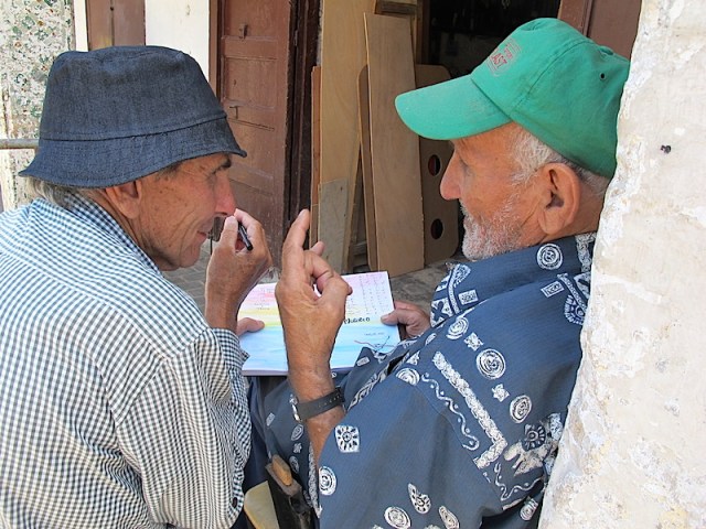  Discussing woodwork joints and Zemanali about to sign my C-Book. 