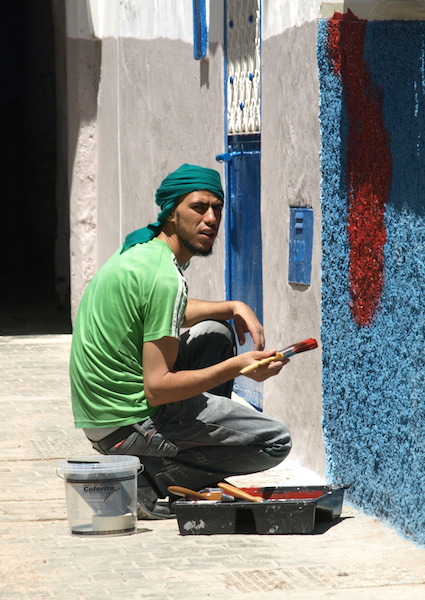 The wall painter’s offsider. 