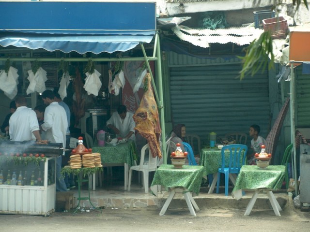 Bus station café. Note the exposed leg of beef hanging in the open and the exposed bread. 