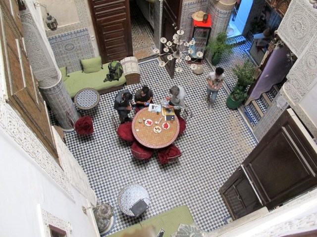 The atrium (courtyard) serving as a sitting/dining area of Dar Lalla Kenza. Talking travel with a couple of fellow travellers. 