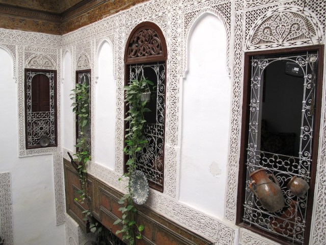 First floor bedroom windows looking into the atrium. Below is the communal courtyard area. 