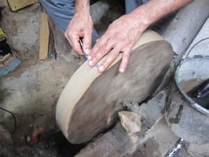 A knife sharpener giving the penknife I bought in Tangier a touch up. 