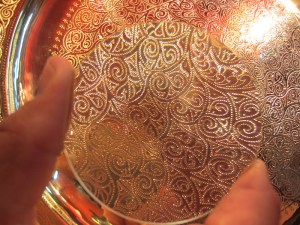 Another hand punched piece. The photograph is taken through a magnifying glass.