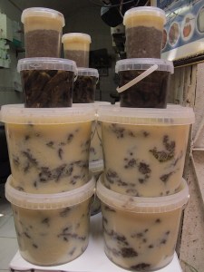 Drums of animal fat. Through the fat were pieces of meat. 