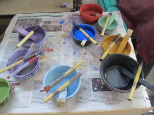  The glaze pots and brushes. 
