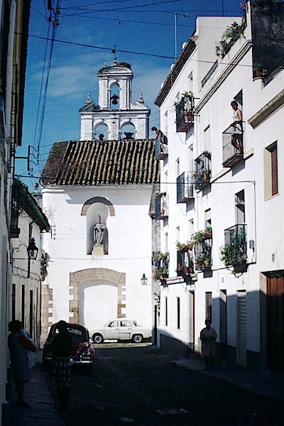 Bev on the balcony in 1973, third floor up on the right. 