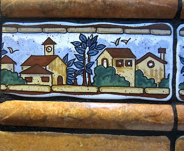 Loo art. These tiles were part of a narrow band of tiles running around the inside of a toilet. The overall height of the blue portion was about 50mm. 