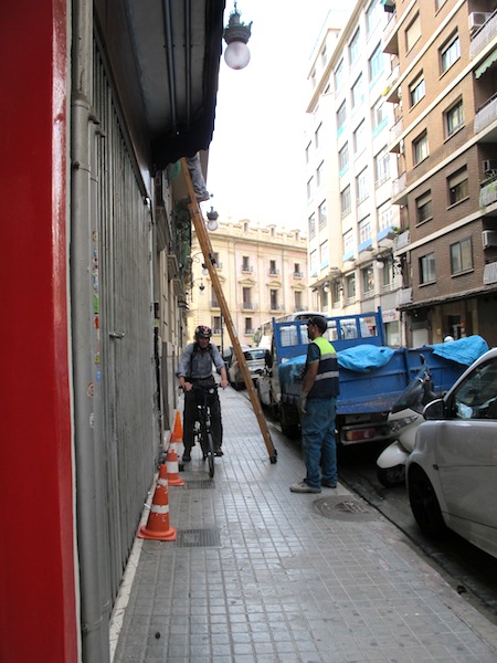 Riding under a ladder is one of the hazards of riding on the footpath. 