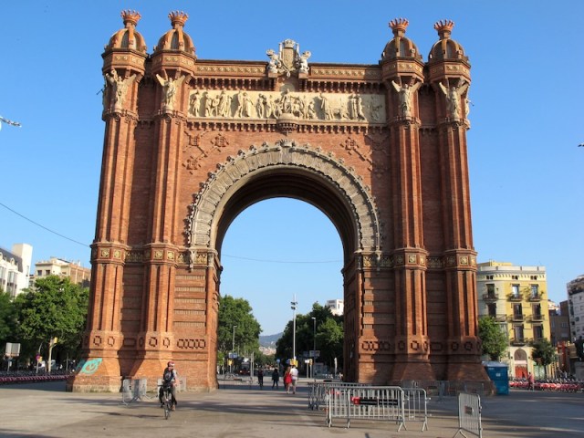 Riding through Barcelona’s Arc de Triomf. The photograph was taken early morning before the tourists hit the streets. The arch was built as the main entrance for the 1888 Barcelona World Fair. 