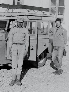 My friend Ian (hand on the rear door), and a border guard who watched over our Landrover throughout the night, Afghanistan.