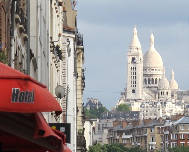 Our backstreet ride to the station. Sacre-Coeur Basilica in the distance and the red awning of Hotel de l’Avenir where we stayed. 