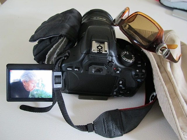 Camera in action sitting on a café table. 